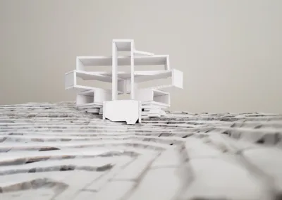 A paper model of a building on top of a mountain.